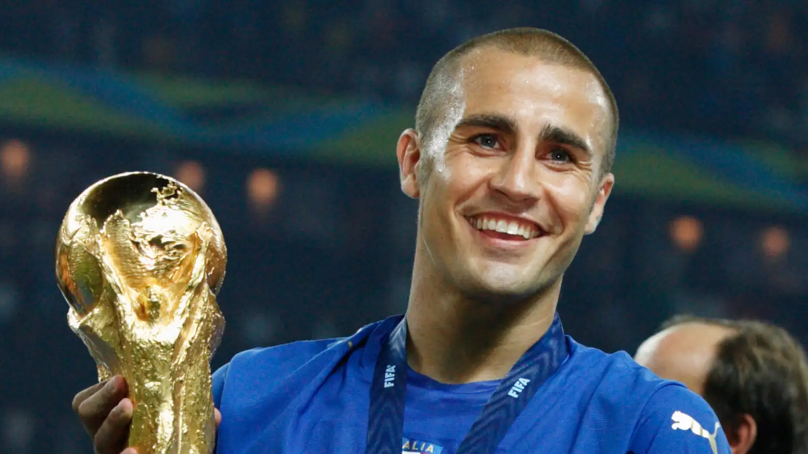 Fabio Cannavaro lifts the FIFA World Cup trophy after the 2006 final between Italy and France at Olympiastadion, Berlin, Germany, July 2006.