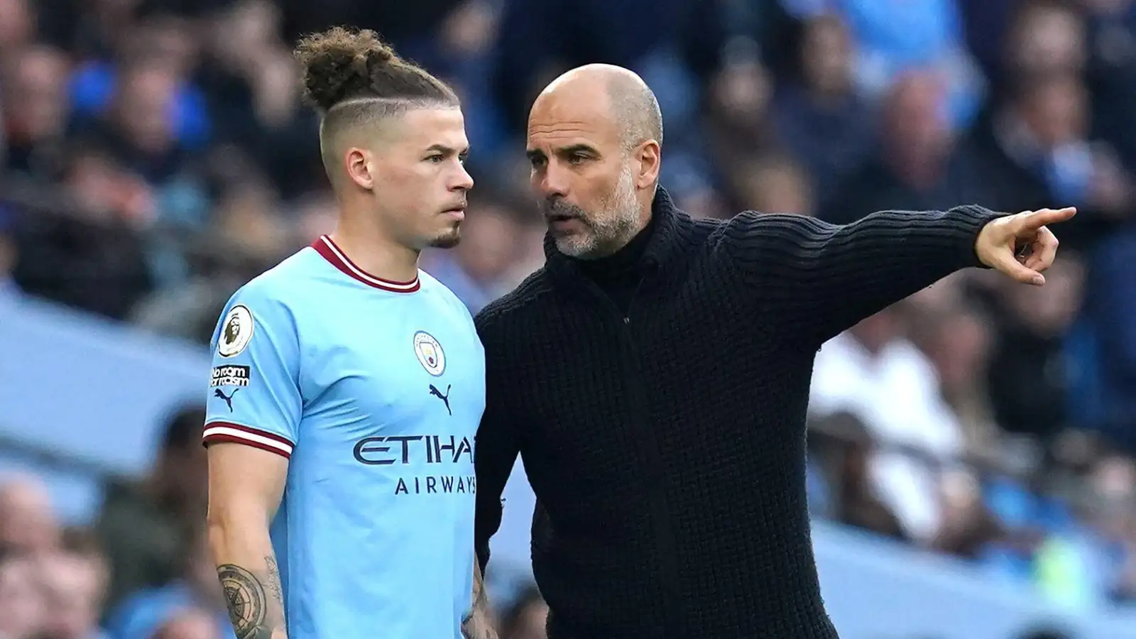 Manchester City manager Pep Guardiola (right) speaks to Kalvin Phillips ahead of being substituted on during the Premier League match at the Etihad Stadium, Manchester. Picture date: Saturday April 15, 2023.