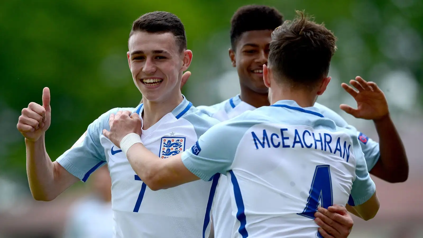 Phil Foden and George McEachran celebrate