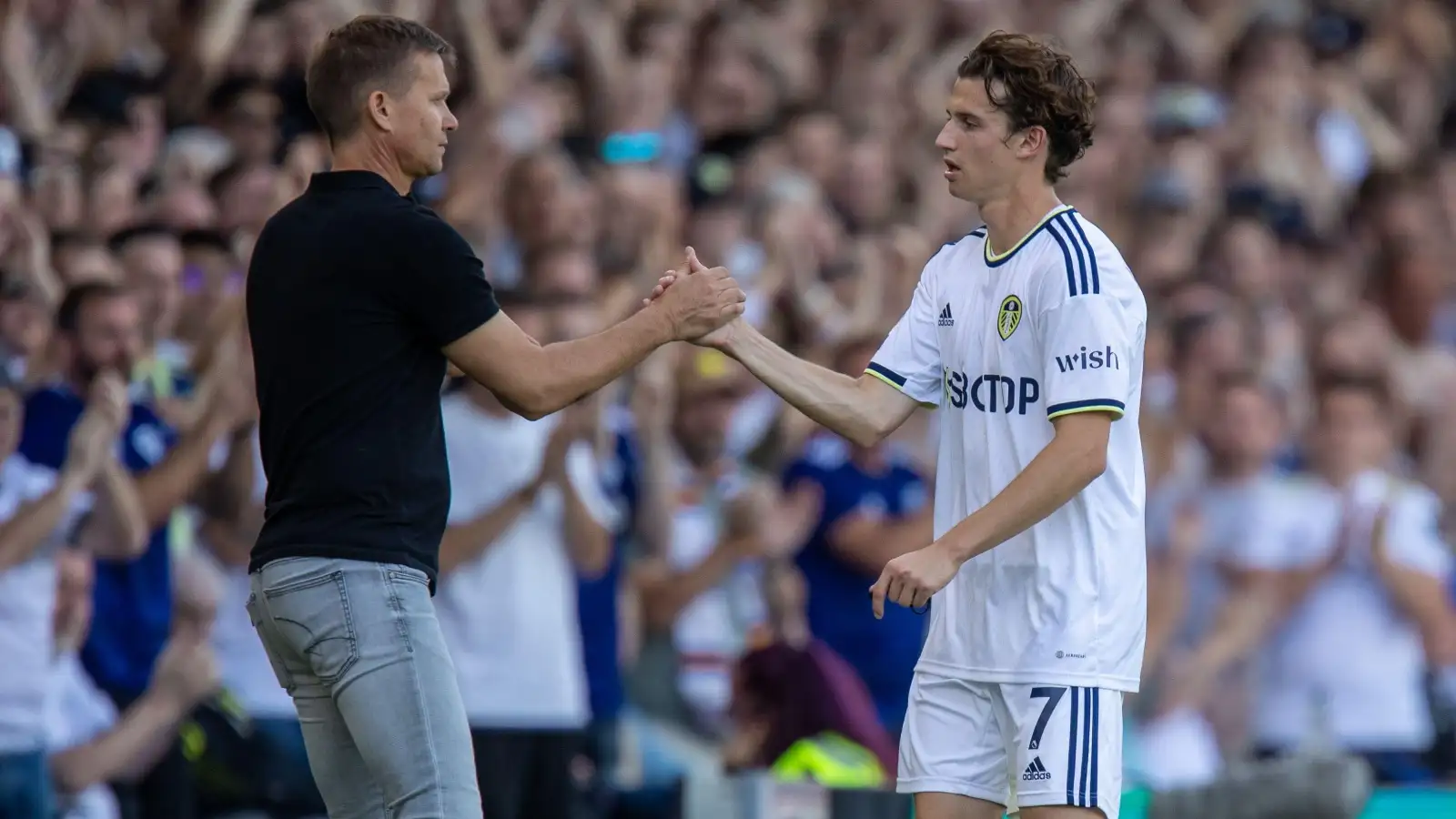 Brenden Aaronson #7 of Leeds United shakes hands with his manager Jesse Marsch as he comes off in the second half