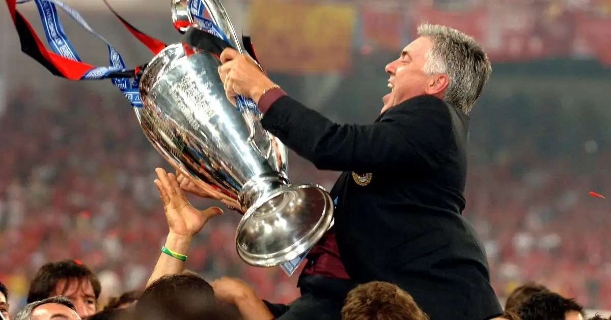 AC Milan manager Carlo Ancelotti celebrates with the Champions League trophy after beating Liverpool. Olympic Stadium, Athens, May 2007.