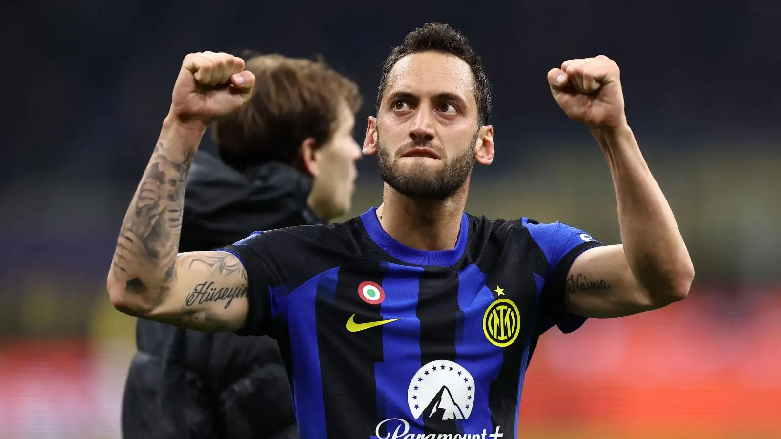 Hakan Calhanoglu celebrates Inter's win over Juventus.